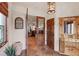 Elegant foyer with tile floors, wooden doors, decorative accents, and a view into the living room at 28098 Green Valley Ln, Conifer, CO 80433