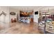 Open kitchen with breakfast bar featuring tile floors and modern appliances at 28098 Green Valley Ln, Conifer, CO 80433