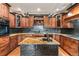 Gourmet kitchen features tile backsplash, granite counters, and stainless steel appliances at 28098 Green Valley Ln, Conifer, CO 80433