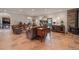 Open-concept living room with ceramic tile floors and comfortable seating arrangements at 28098 Green Valley Ln, Conifer, CO 80433