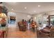 Spacious living room with arched entryways and ceramic tile flooring at 28098 Green Valley Ln, Conifer, CO 80433