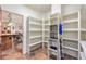 A well-organized pantry with white shelving offers ample storage space at 28098 Green Valley Ln, Conifer, CO 80433