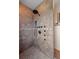 Custom tile shower with multiple shower heads and handheld fixture at 28098 Green Valley Ln, Conifer, CO 80433