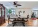 Dining area with hardwood floors, wooden table and bench, and a Christmas tree at 3500 W 55Th Ave, Denver, CO 80221