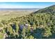 Expansive view of a secluded home nestled amongst trees, offering privacy and scenic beauty at 9041 Eastridge Rd, Golden, CO 80403