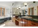 Bathroom offers dual vanities, large mirrors, a soaking tub and glass shower at 9041 Eastridge Rd, Golden, CO 80403
