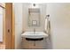 Modern powder room with a sleek sink and stylish mirror creating a clean and contemporary look at 9041 Eastridge Rd, Golden, CO 80403