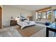 Inviting bedroom with a window bench offering natural light, a cozy rug, and neutral décor at 9041 Eastridge Rd, Golden, CO 80403