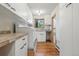 Laundry room featuring modern washer and dryer, and ample counter space at 9041 Eastridge Rd, Golden, CO 80403