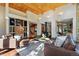Open living area with wood ceilings, hardwood floors and lots of natural light at 9041 Eastridge Rd, Golden, CO 80403