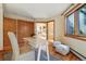 Bright office space with hardwood floors, desk, chair, and large window at 9041 Eastridge Rd, Golden, CO 80403
