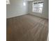 Neutral toned carpeted floor with natural light from large windows at 2176 S Haleyville Way, Aurora, CO 80018