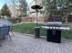 Relaxing patio area with a grill, heater, and seating, perfect for entertaining in the backyard at 5724 S Rome St, Aurora, CO 80015