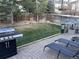 Well-maintained backyard with a grill, lounge chairs, a playhouse, and plenty of green space at 5724 S Rome St, Aurora, CO 80015