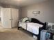 A cute bedroom with play kitchen set, black daybed and closet space in a neutral color scheme at 5724 S Rome St, Aurora, CO 80015
