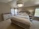 This main bedroom features stylish decor, a large bed, and a comfortable, inviting atmosphere at 5724 S Rome St, Aurora, CO 80015