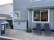 Charming patio with outdoor seating, convenient storage, a cute playhouse, and a cozy fire pit at 5724 S Rome St, Aurora, CO 80015