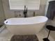 Modern soaking tub with matte black fixtures at 5724 S Rome St, Aurora, CO 80015