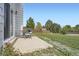 This backyard features a grill with a patio and large fenced yard with trees at 9630 W 104Th Ave, Broomfield, CO 80021