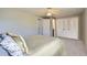 This bedroom features natural lighting, soft carpet, and a neutral palette at 9630 W 104Th Ave, Broomfield, CO 80021