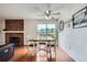 Dining area with a view of the outdoors and a fireplace at 9630 W 104Th Ave, Broomfield, CO 80021