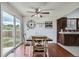 Bright dining area with a sliding glass door and a ceiling fan fixture at 9630 W 104Th Ave, Broomfield, CO 80021
