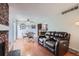 Open-concept living space with dining area, fireplace, and comfortable seating at 9630 W 104Th Ave, Broomfield, CO 80021