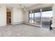 Living room with fireplace, balcony access, and kitchen views at 1200 N Humboldt St # 1103, Denver, CO 80218