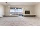 Living room with fireplace and sliding glass door to balcony at 1200 N Humboldt St # 1103, Denver, CO 80218