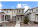 Charming two-story home with stone accents, a covered porch, and well-maintained landscaping at 23630 E 5Th Pl, Aurora, CO 80018