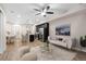 Open-concept living area featuring modern furnishings and stainless steel appliances at 23630 E 5Th Pl, Aurora, CO 80018