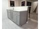 Stylish wet bar featuring sleek countertops, a sink, and cabinetry for storage at 3281 Vivian Dr, Wheat Ridge, CO 80033