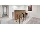 Chic bar area featuring seating for three, wood paneling and modern finishes at 3281 Vivian Dr, Wheat Ridge, CO 80033
