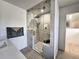Modern bathroom with glass shower and marble-look tile, and updated fixtures at 3281 Vivian Dr, Wheat Ridge, CO 80033
