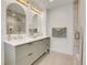 Modern bathroom features double vanity, gold fixtures, and a glass-enclosed shower at 3281 Vivian Dr, Wheat Ridge, CO 80033