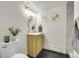 Well-lit bathroom featuring modern fixtures, a vanity, and a stylish vanity at 3281 Vivian Dr, Wheat Ridge, CO 80033