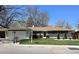 Charming single-story home featuring a well-manicured lawn, two-car garage, and inviting curb appeal at 3281 Vivian Dr, Wheat Ridge, CO 80033
