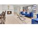 Inviting living room with fireplace, large windows, and a comfortable blue sofa at 3281 Vivian Dr, Wheat Ridge, CO 80033