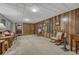 This basement features wood paneling, carpet flooring, a storage room, and ample space at 7479 Pierce St, Arvada, CO 80003