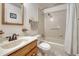This bathroom features a single vanity, a toilet, and a shower/tub combination at 7479 Pierce St, Arvada, CO 80003