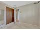 This bedroom features neutral carpet flooring and a large closet space at 7479 Pierce St, Arvada, CO 80003