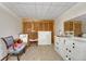 Bedroom featuring carpet floors, closet with folding doors, neutral paint, and a cozy rocking chair at 7479 Pierce St, Arvada, CO 80003