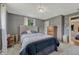 This bedroom features carpet, light gray walls, a dresser, and plenty of natural light at 7479 Pierce St, Arvada, CO 80003