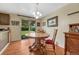 Cozy dining area features a wooden table with chairs, and a sliding door to the lawn at 7479 Pierce St, Arvada, CO 80003