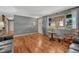 Inviting living room boasts hardwood floors, neutral decor, and an inviting atmosphere with natural lighting at 7479 Pierce St, Arvada, CO 80003