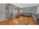 Spacious living room with hardwood floors, neutral walls, and ample natural light from a large window at 7479 Pierce St, Arvada, CO 80003