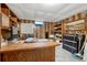 Home office featuring wood paneling, a large desk, built-in shelves, and a white board for brainstorming sessions at 7479 Pierce St, Arvada, CO 80003