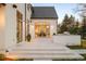 Luxury backyard featuring a stone patio, built-in grill, and an outdoor kitchen at 20 Viking Dr, Cherry Hills Village, CO 80113