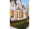 Detailed exterior shot features bay windows, manicured lawn, and beautiful sunset lighting at 20 Viking Dr, Cherry Hills Village, CO 80113