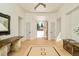 Bright foyer with hardwood floors, open archway, designer lighting and decor at 20 Viking Dr, Cherry Hills Village, CO 80113